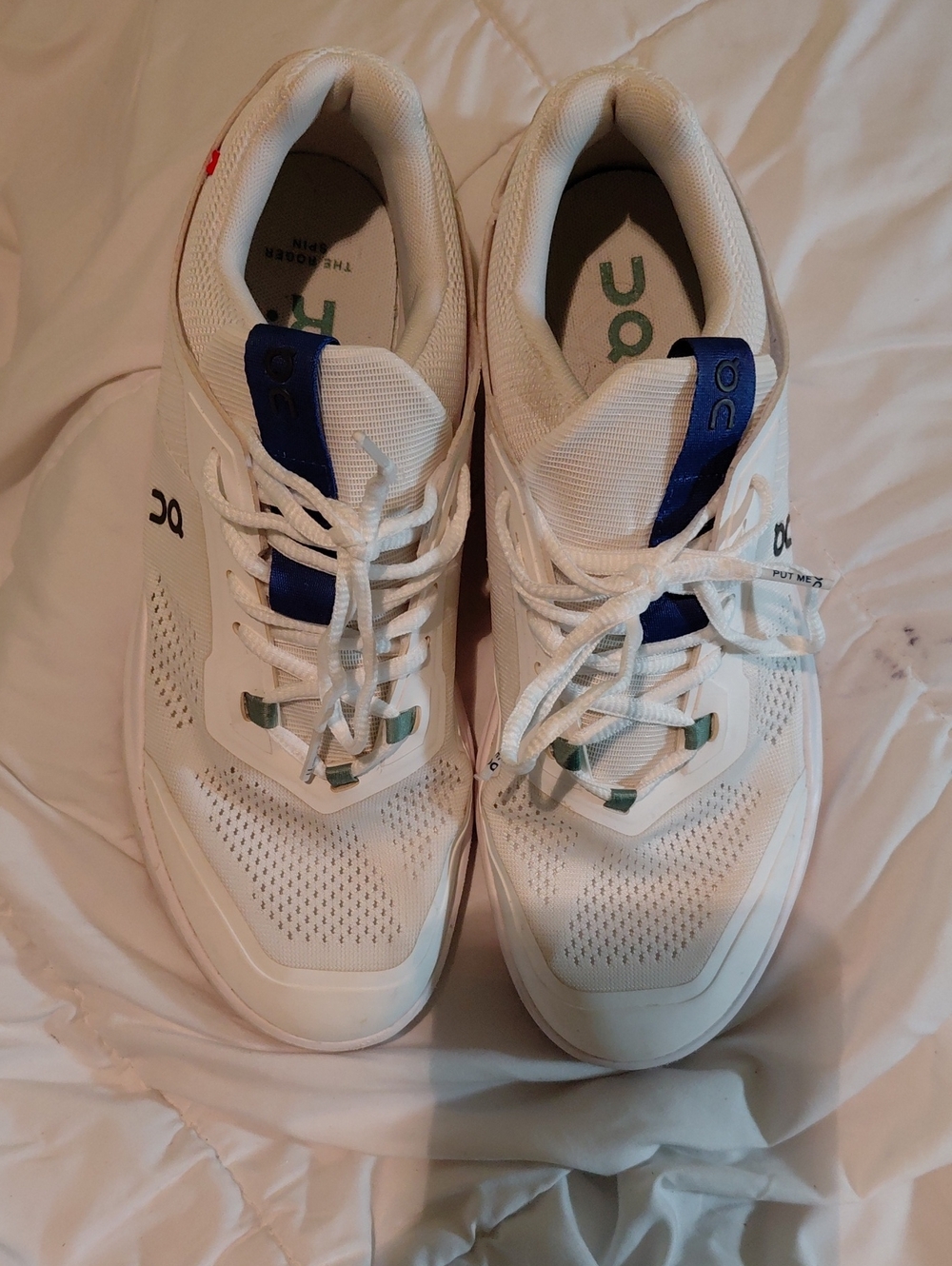 On Running White Sneakers with Blue Accents